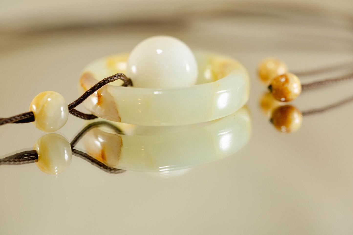 White and Yellow Jade Ring and Sphere Pendant Handcarved from Siberian Jade on Paracord with Four Siberian Accent Beads