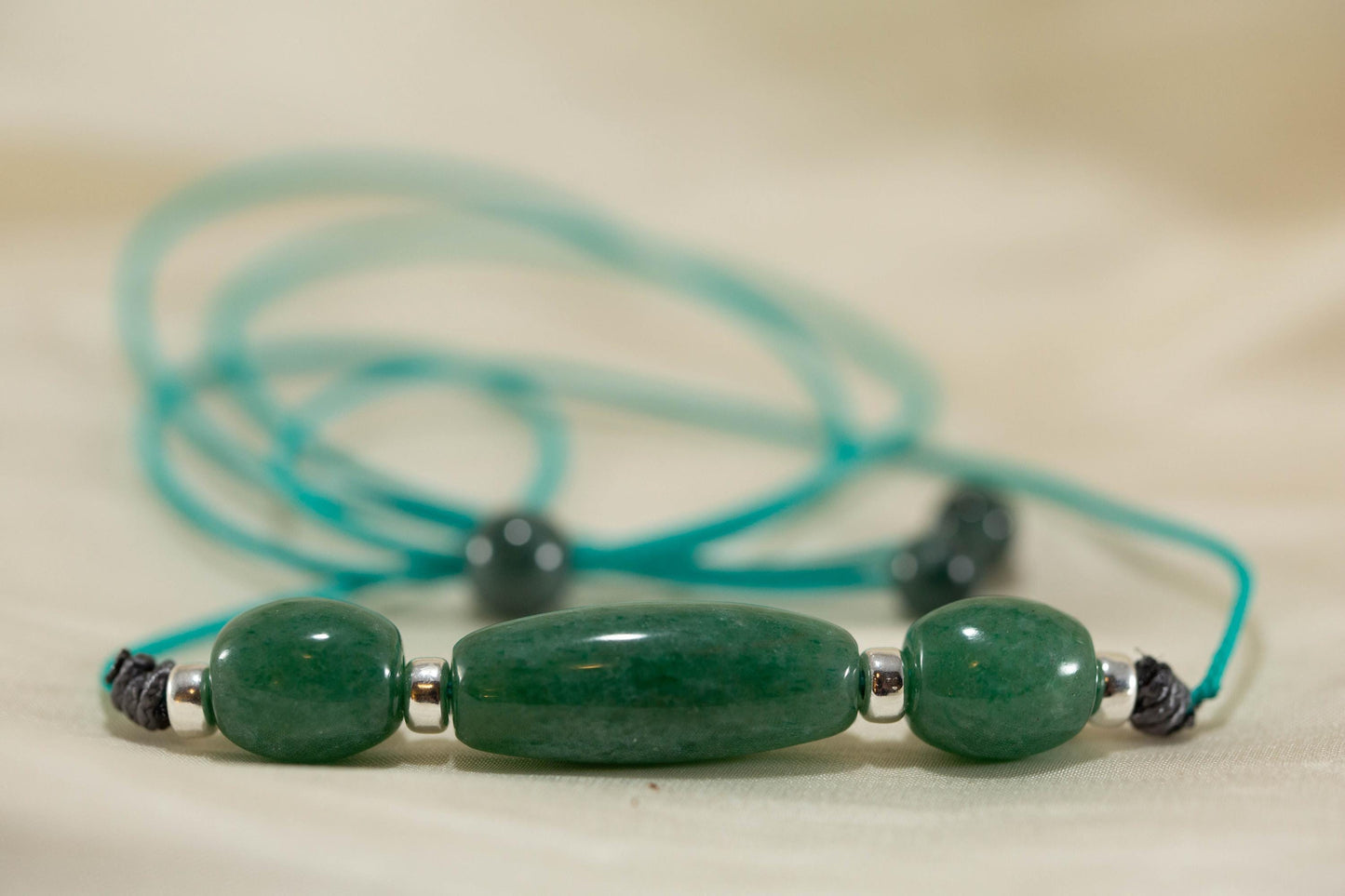 Blue Green Three Bead Pendant Handcarved from Apatite Stone. Strung on Paracord With Silver Spacers.