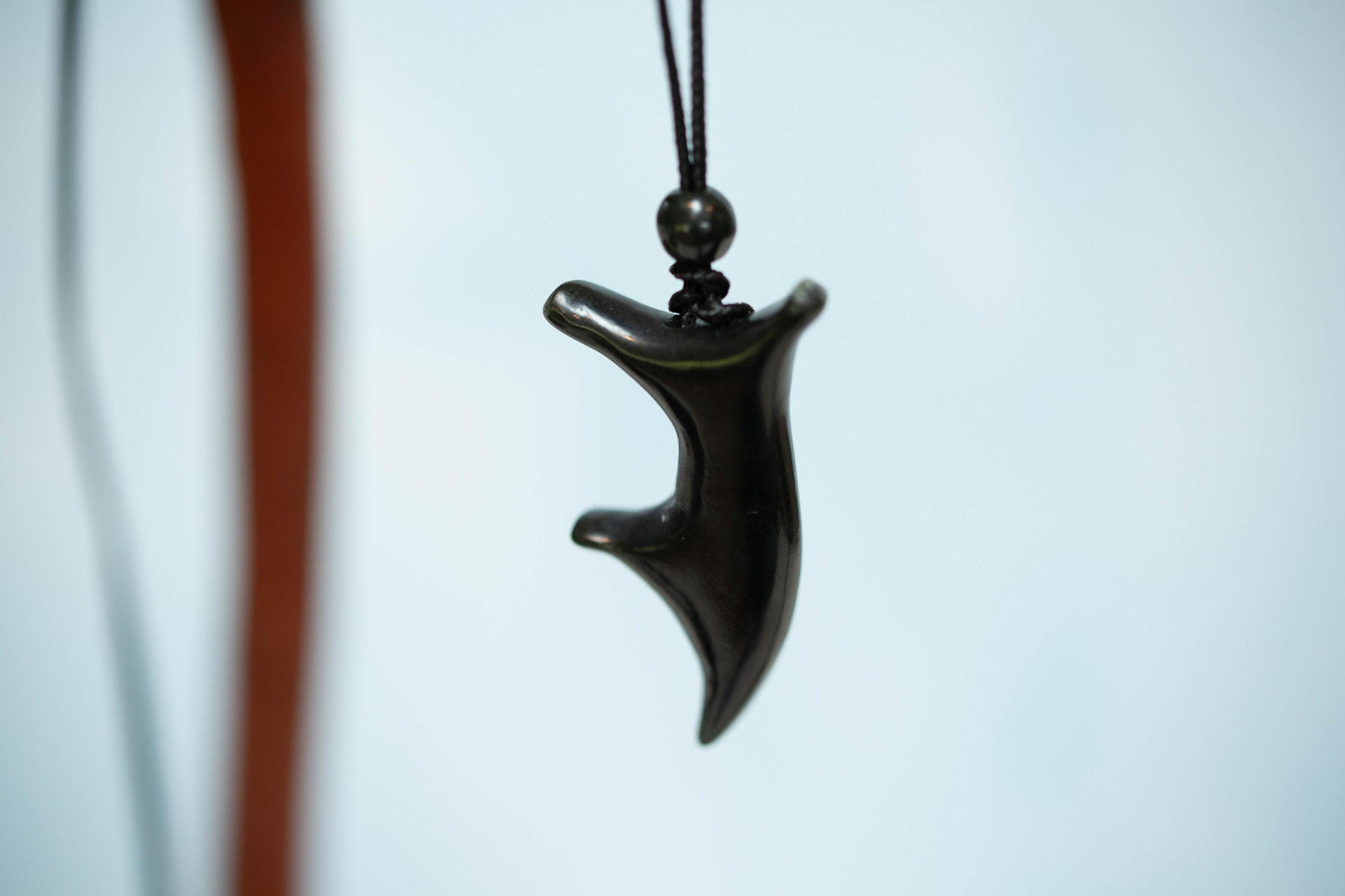 Joyful Dancer Jade Pendant. Hand carved from Dark Olive Wyoming Jade on Paracord with Matching Finish Beads.