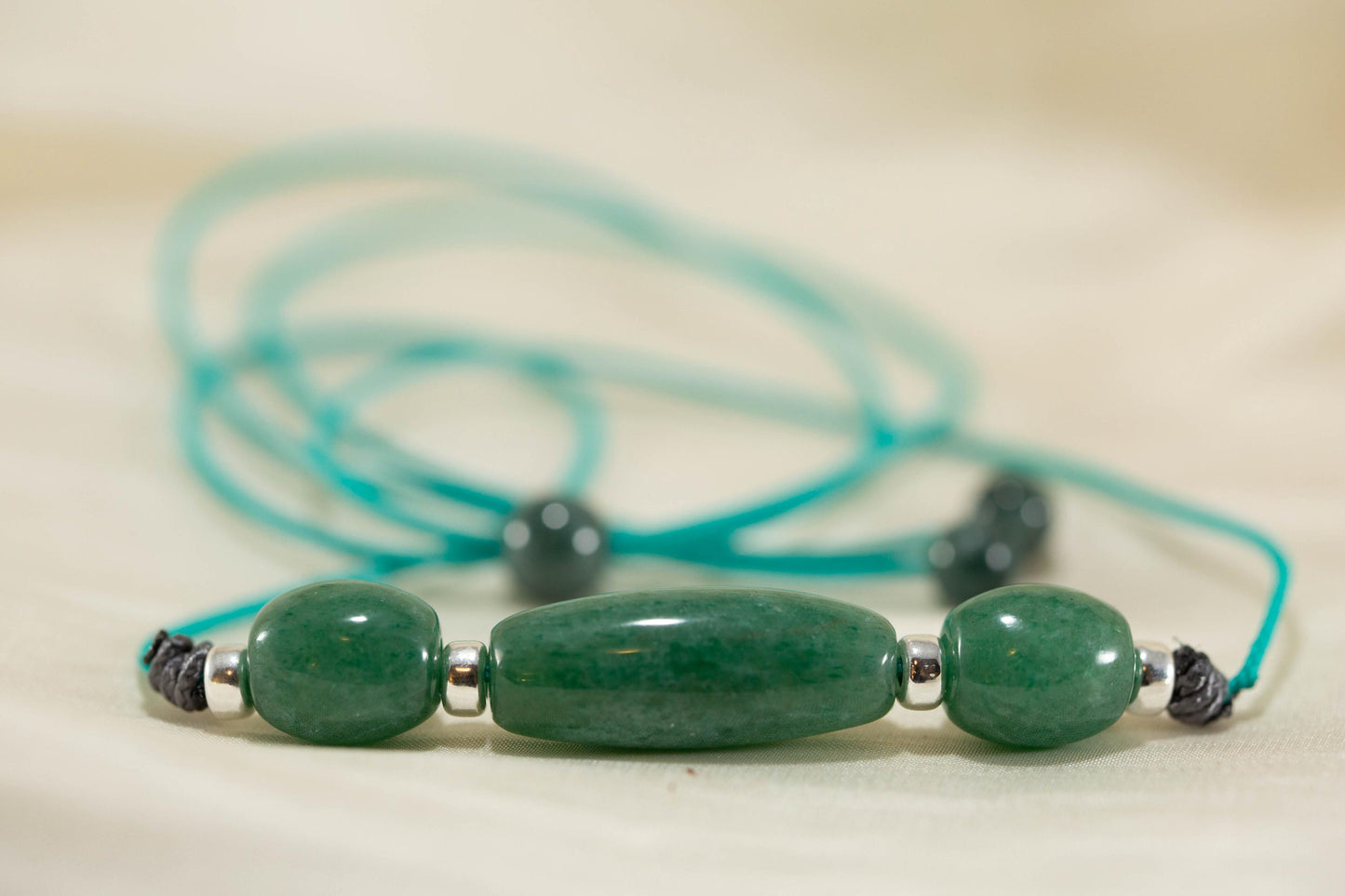 Blue Green Three Bead Pendant Handcarved from Apatite Stone. Strung on Paracord With Silver Spacers.