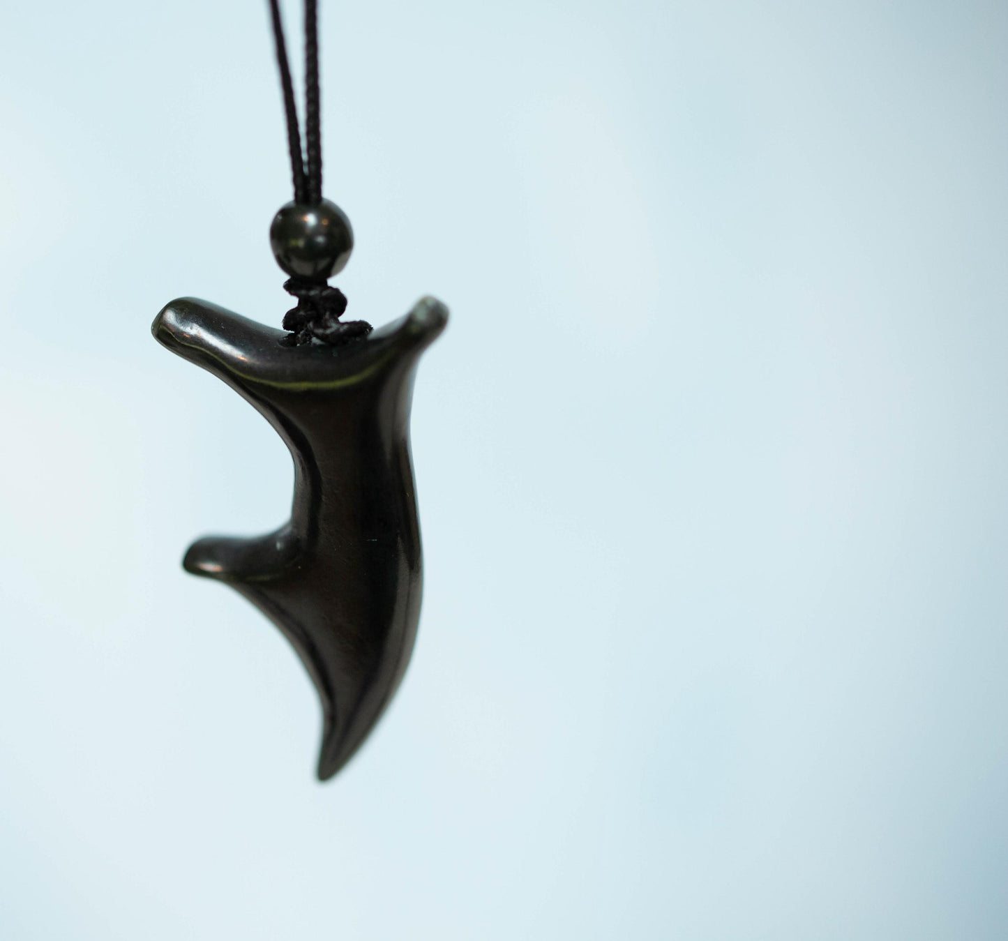 Joyful Dancer Jade Pendant. Hand carved from Dark Olive Wyoming Jade on Paracord with Matching Finish Beads.